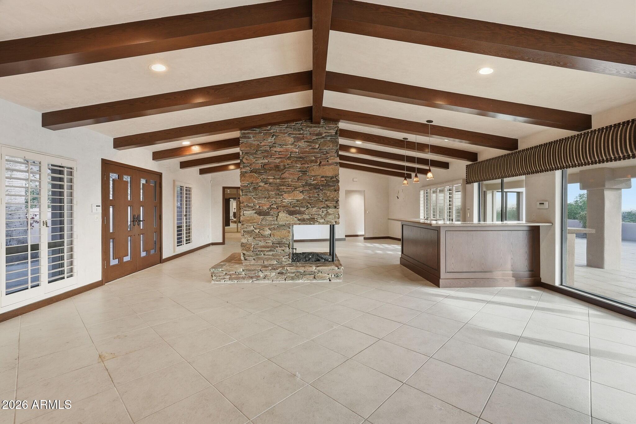 4021 East Lamar Road Paradise Valley, AZ 85253 - Photo 15 of 48 a view of an empty room and chandelier fan