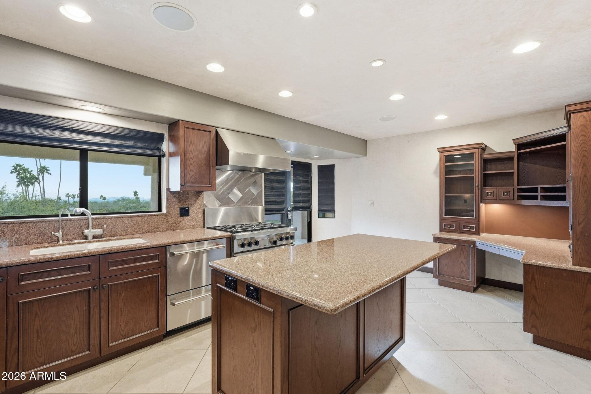 4021 East Lamar Road Paradise Valley, AZ 85253 - Photo 18 of 48 a kitchen with a sink and counter top space