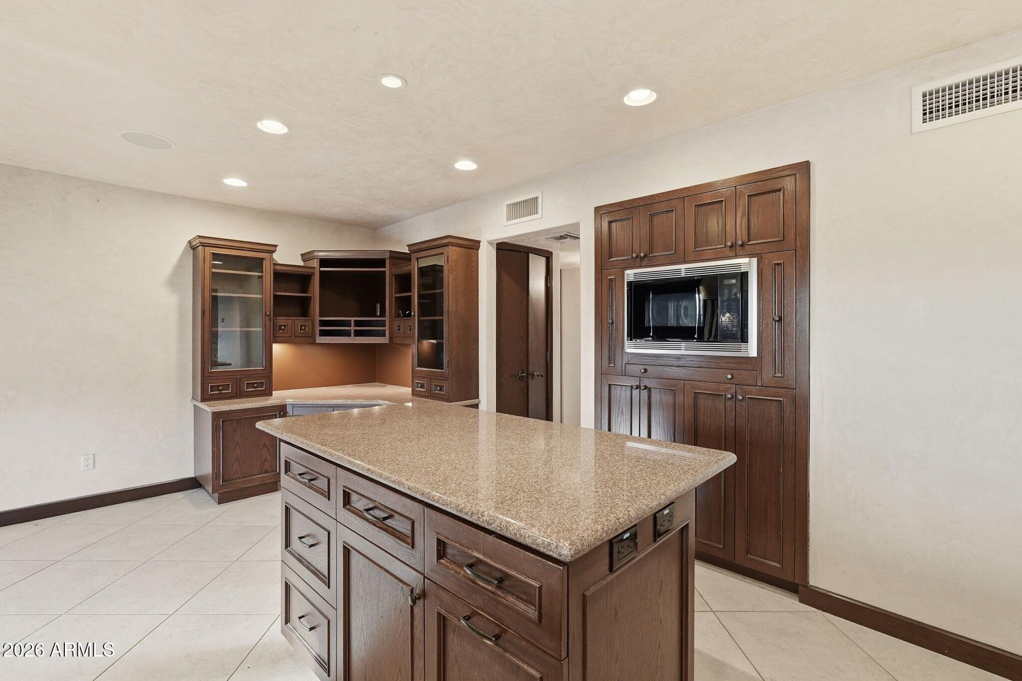 4021 East Lamar Road Paradise Valley, AZ 85253 - Photo 20 of 48 a kitchen with a stove a refrigerator and a microwave