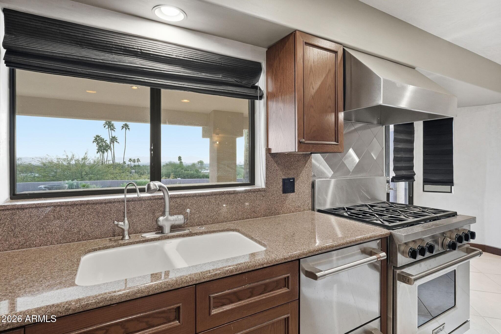 4021 East Lamar Road Paradise Valley, AZ 85253 - Photo 21 of 48 a kitchen with a sink and a large window