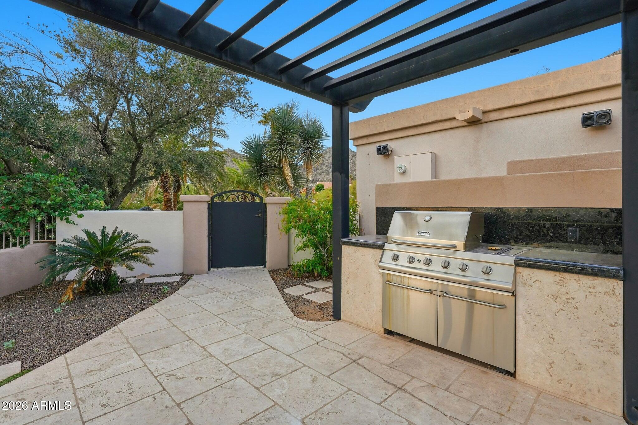 4021 East Lamar Road Paradise Valley, AZ 85253 - Photo 37 of 48 a kitchen with a stove and a white roof