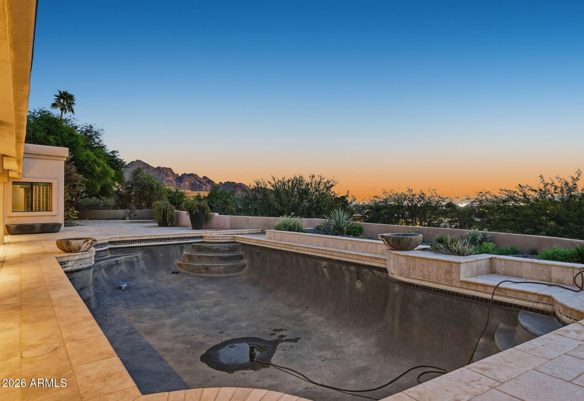 4021 East Lamar Road Paradise Valley, AZ 85253 - Photo 44 of 48 a view of a swimming pool with a back yard