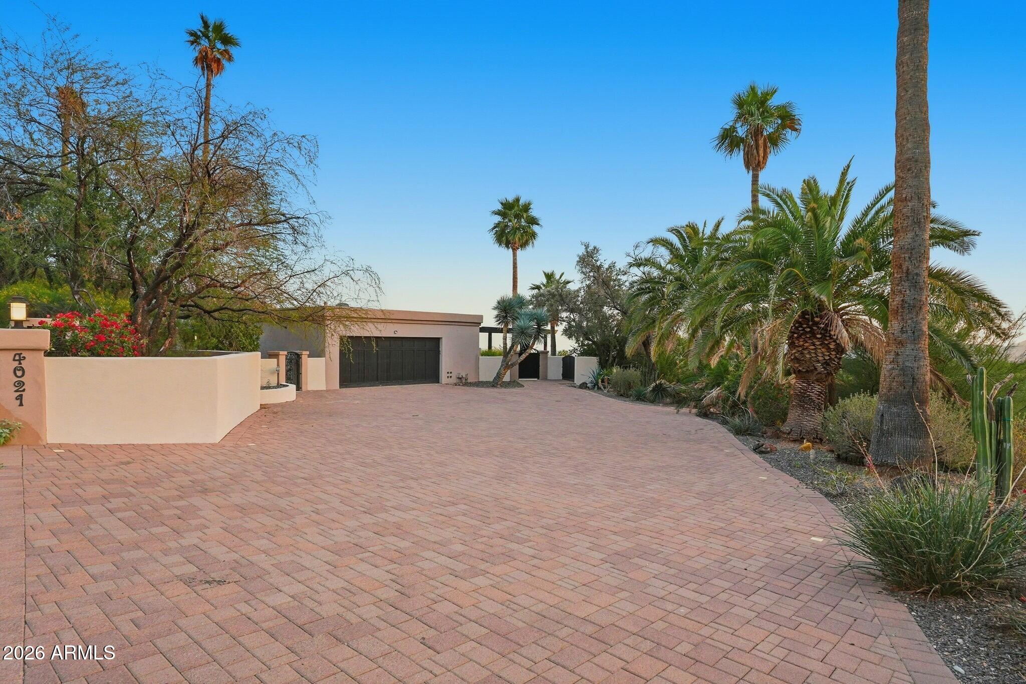 4021 East Lamar Road Paradise Valley, AZ 85253 - Photo 9 of 48 a view of a house with a yard and a tree