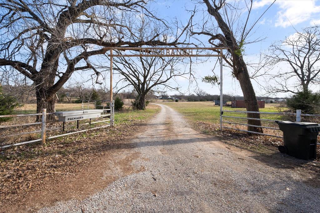 443 County Road 3799 Springtown, TX 76082 - Photo 31 of 33 View of street featuring a view of rural / pastoral area and a gate