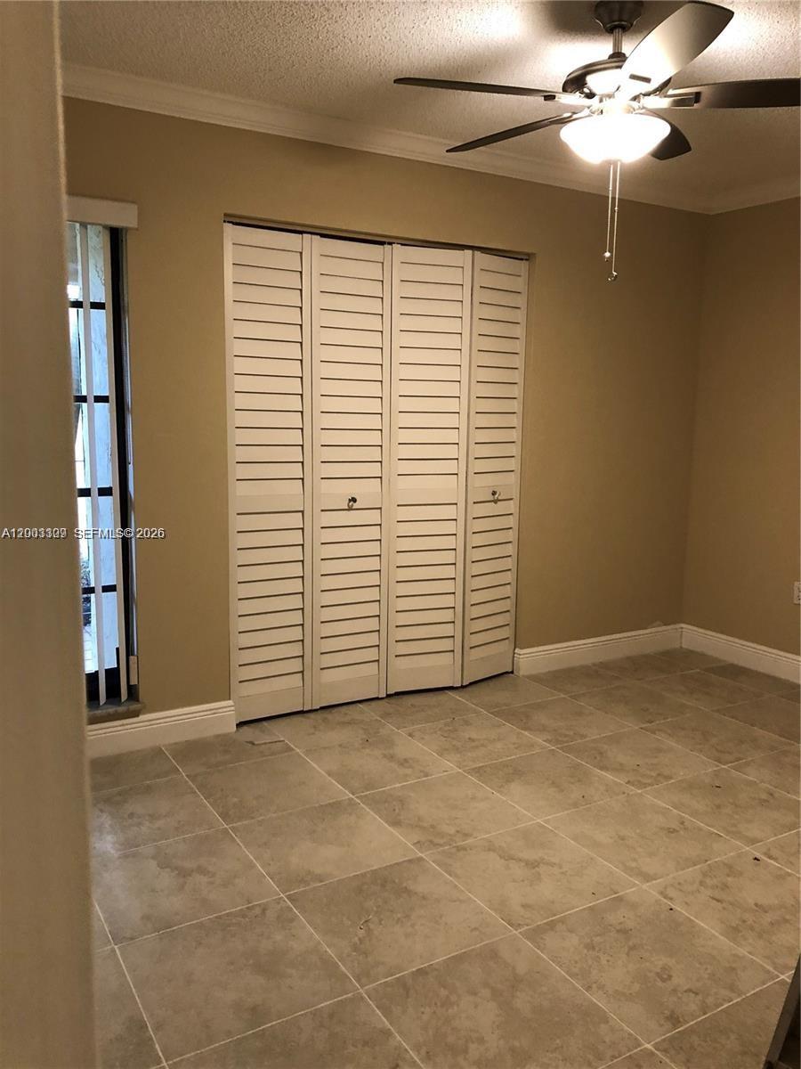 9164 Southwest 132nd Lane Miami, FL 33176 - Photo 9 of 15 a view of an empty room with a window