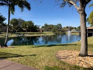 9164 Southwest 132nd Lane Miami, FL 33176 - Photo 10 of 15 a view of a lake with palm trees