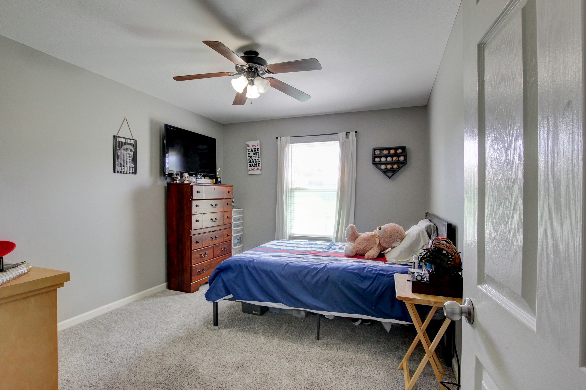 2907 Rome Lane Clarksville, TN 37040 - Photo 12 of 20 a bedroom with a bed and a chandelier
