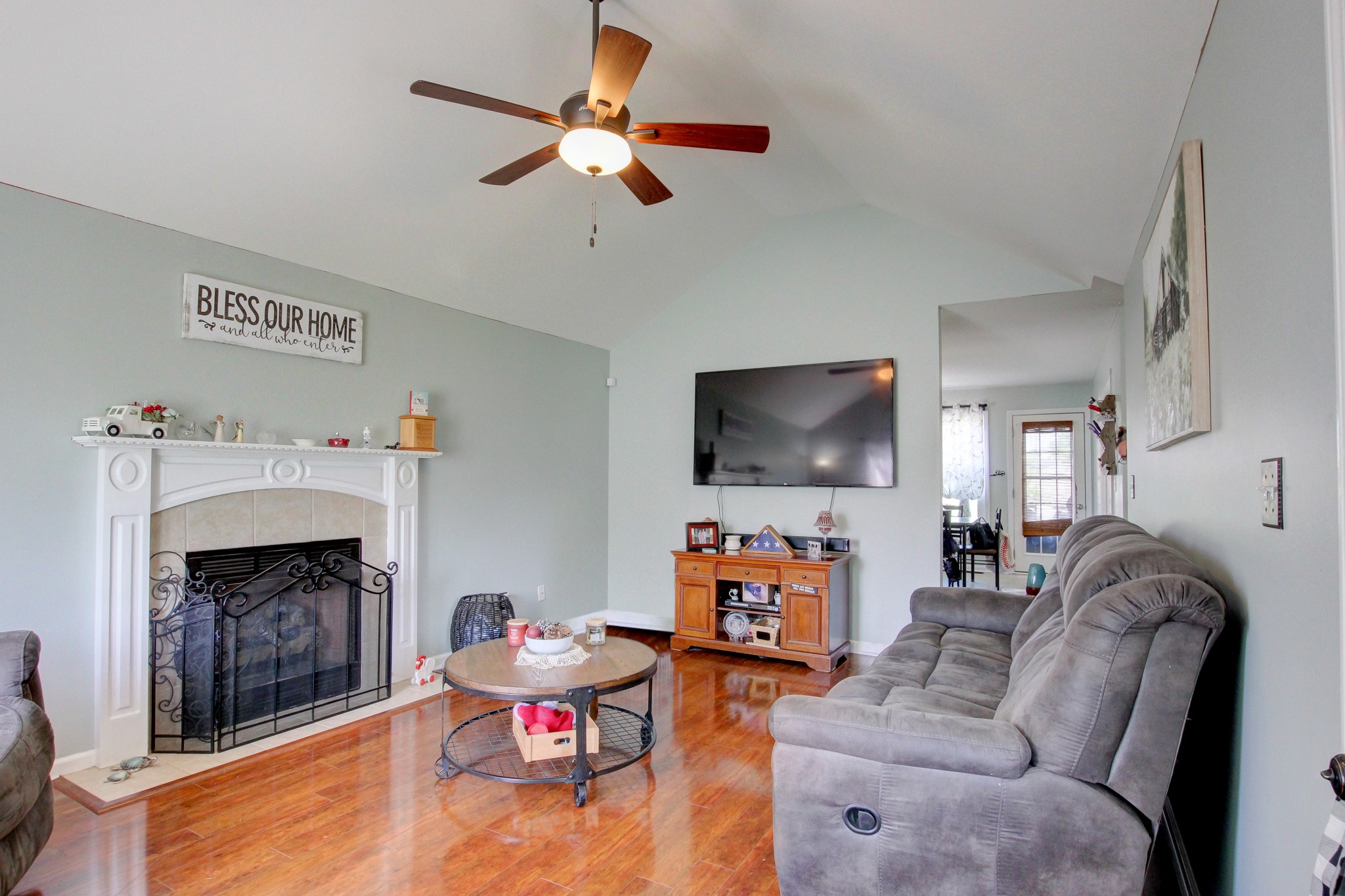 2907 Rome Lane Clarksville, TN 37040 - Photo 4 of 20 a living room with furniture a flat screen tv and a fireplace