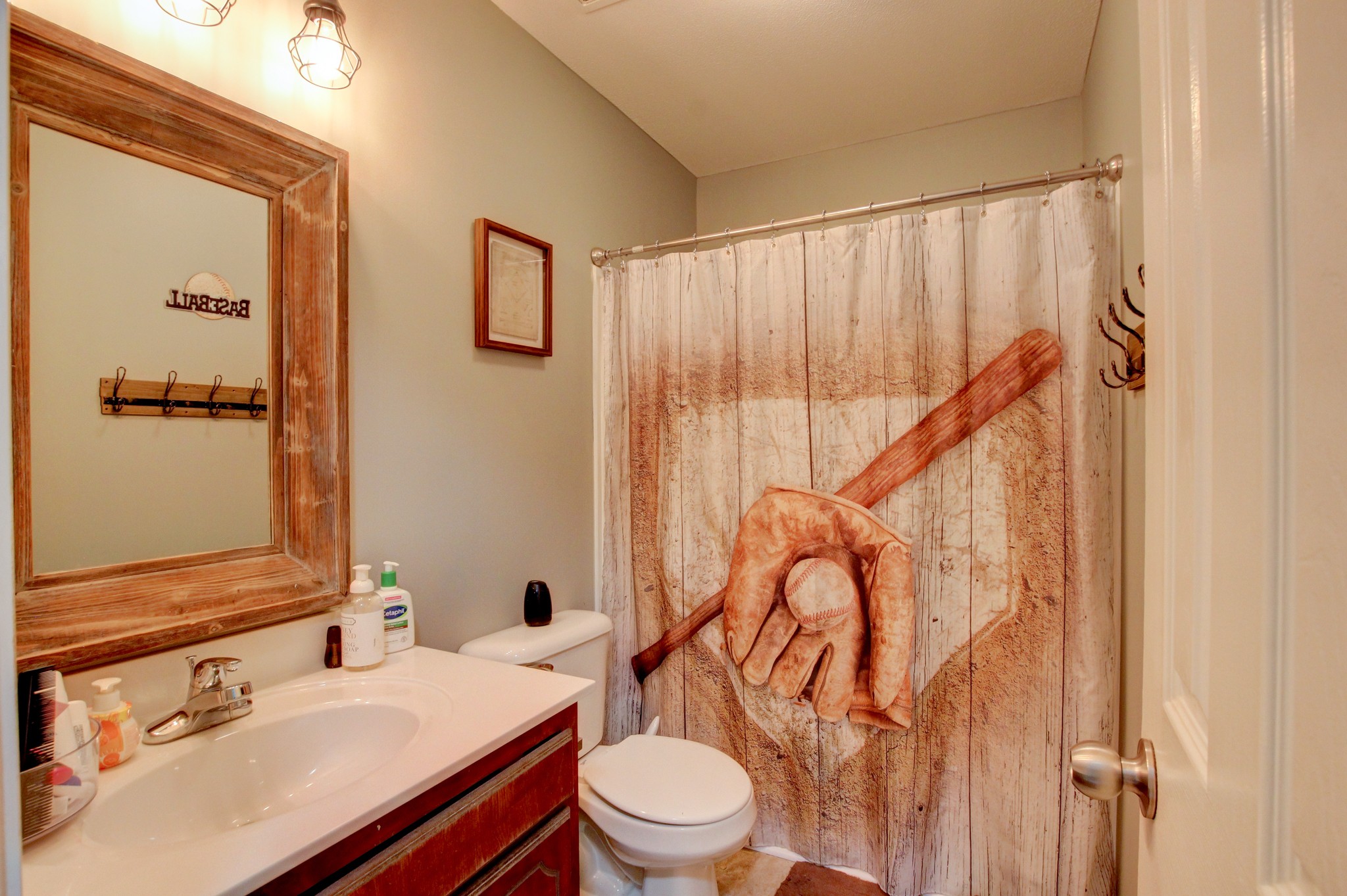 2907 Rome Lane Clarksville, TN 37040 - Photo 9 of 20 a bathroom with a sink a toilet and a mirror