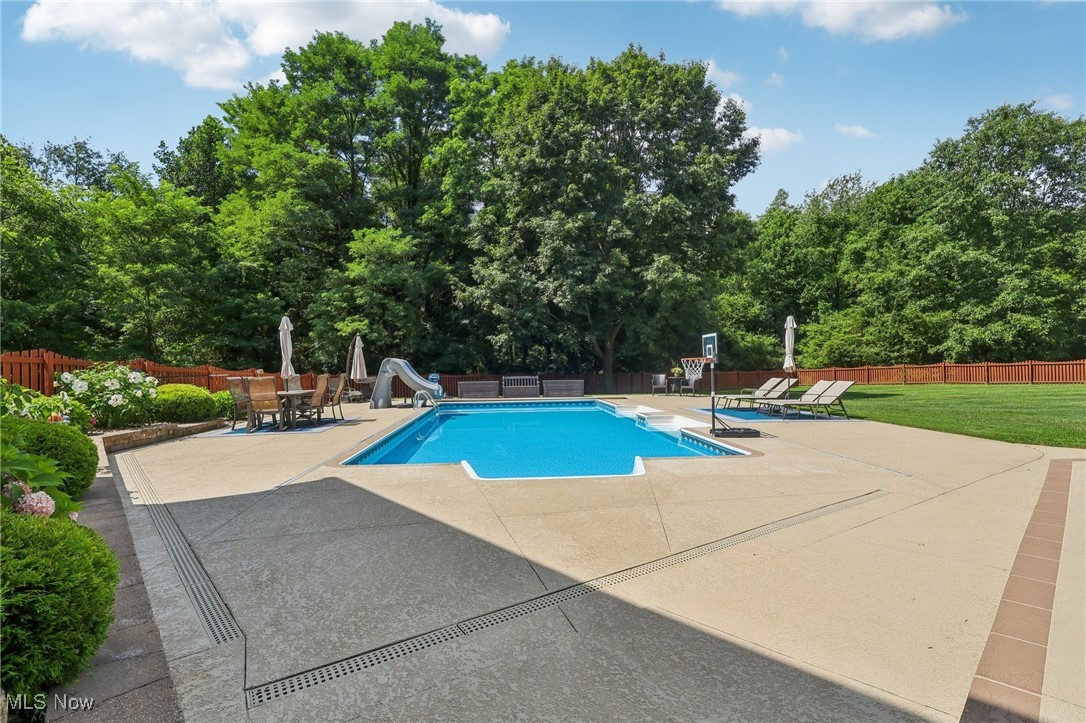 230 South Medina Line Road Akron, OH 44321 - Photo 37 of 50 View of pool featuring a water slide, a patio, and a fenced backyard