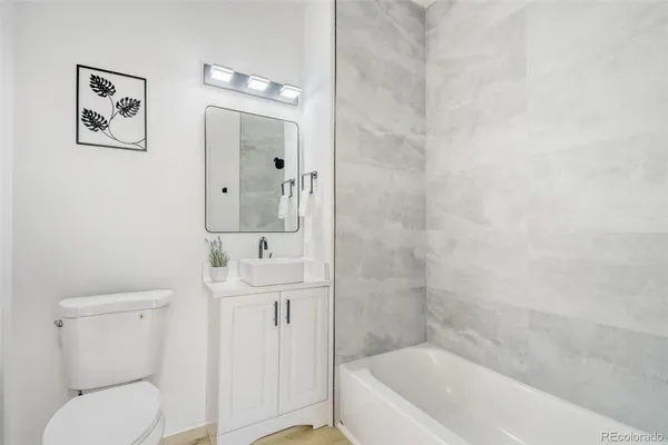 a bathroom with a toilet sink and bathtub