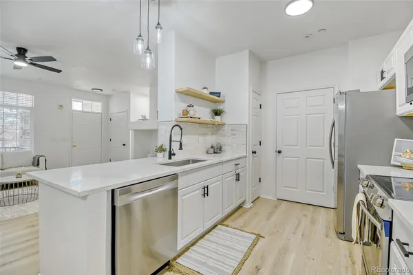a spacious bathroom with a sink a mirror and a shower
