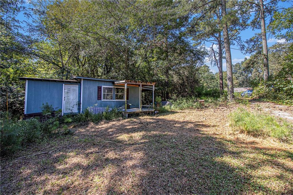 655 Hall Station Road Northwest Kingston, GA 30145 - Photo 15 of 17 a view of a house with a yard