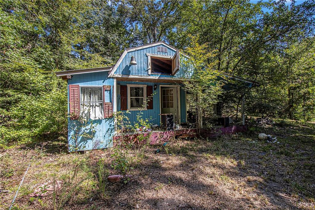 655 Hall Station Road Northwest Kingston, GA 30145 - Photo 16 of 17 front view of a house with a yard