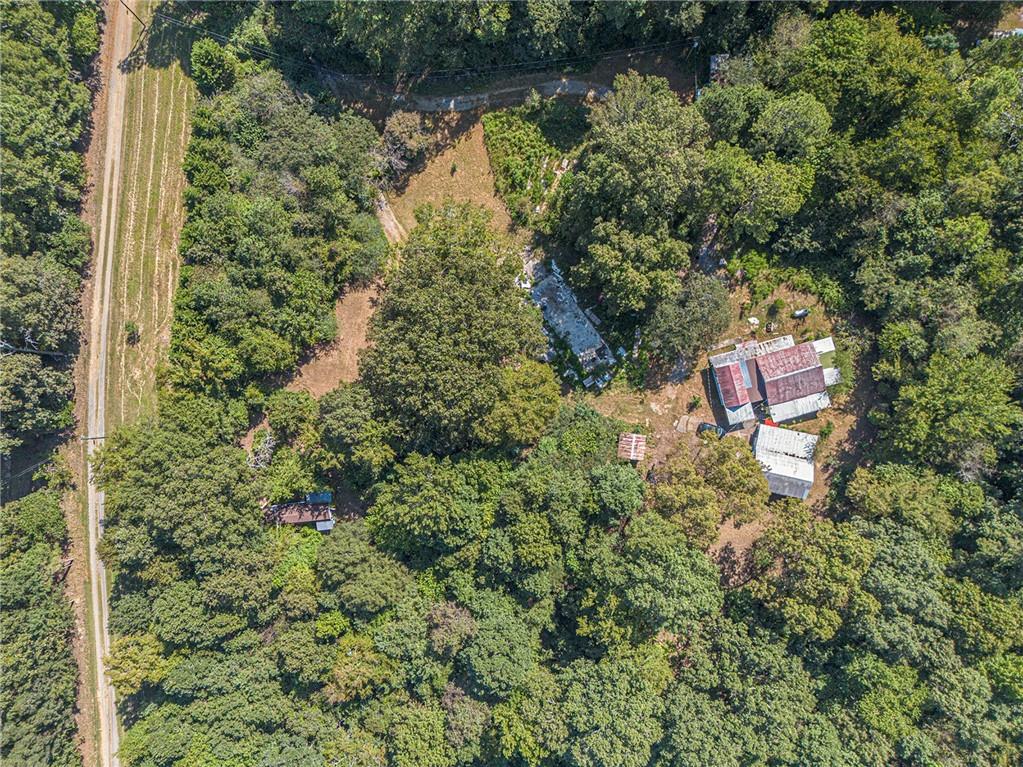 655 Hall Station Road Northwest Kingston, GA 30145 - Photo 8 of 17 a backyard of a house with a yard and outdoor seating