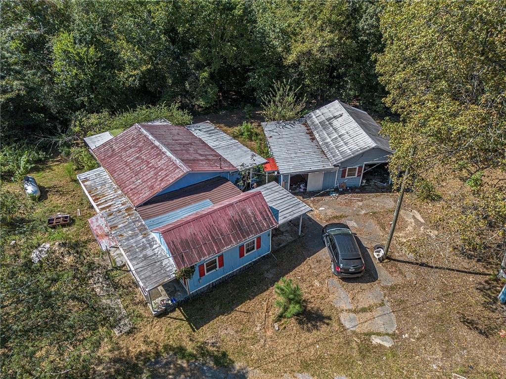 655 Hall Station Road Northwest Kingston, GA 30145 - Photo 9 of 17 a view of a patio with table and chairs with wooden floor and fence