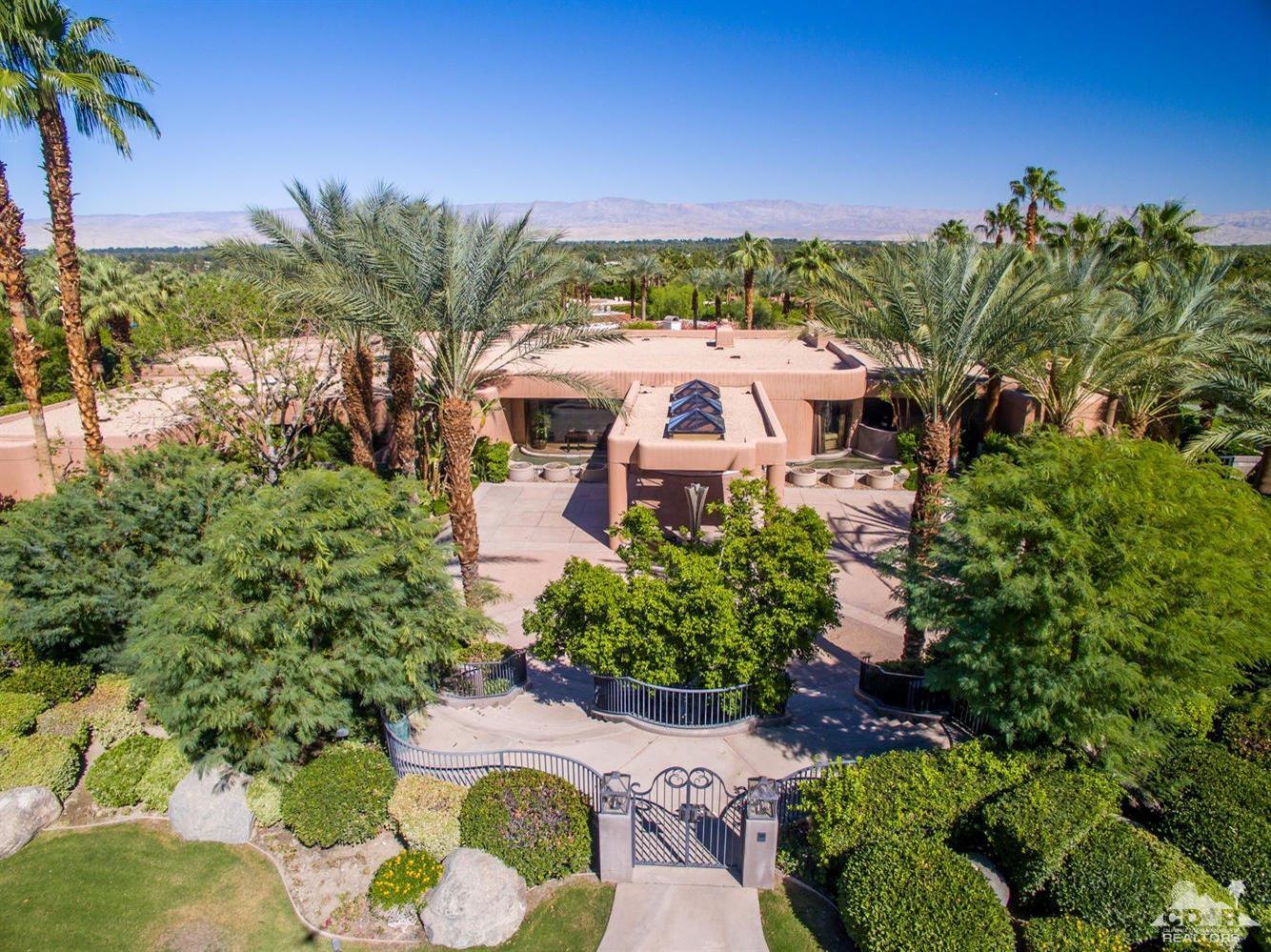 70416 Placerville Road Rancho Mirage, CA 92270 - Photo 2 of 32 a view of a patio with furniture and a garden