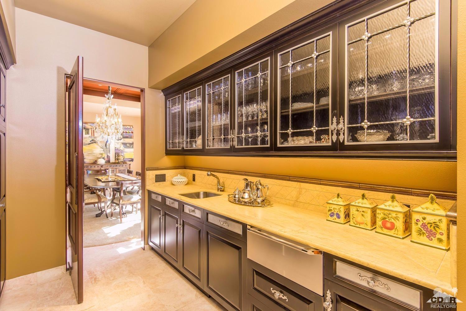70416 Placerville Road Rancho Mirage, CA 92270 - Photo 16 of 32 a view of a kitchen with stainless steel appliances granite countertop a stove and a large window