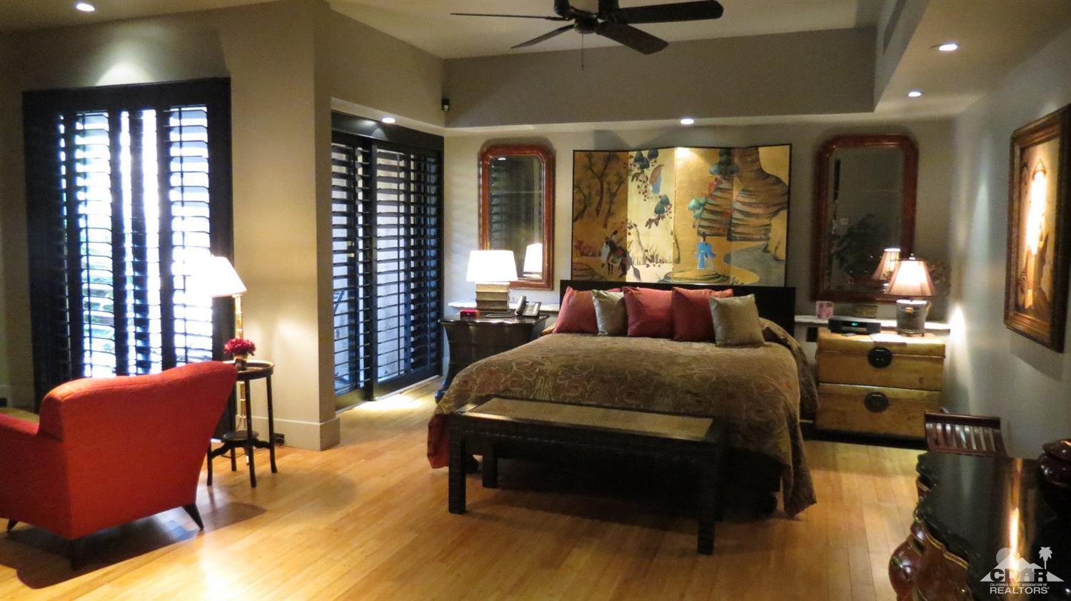70416 Placerville Road Rancho Mirage, CA 92270 - Photo 19 of 32 a bed room with a bed and furniture