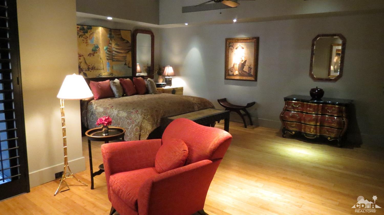 70416 Placerville Road Rancho Mirage, CA 92270 - Photo 20 of 32 a bedroom with furniture and a lamp