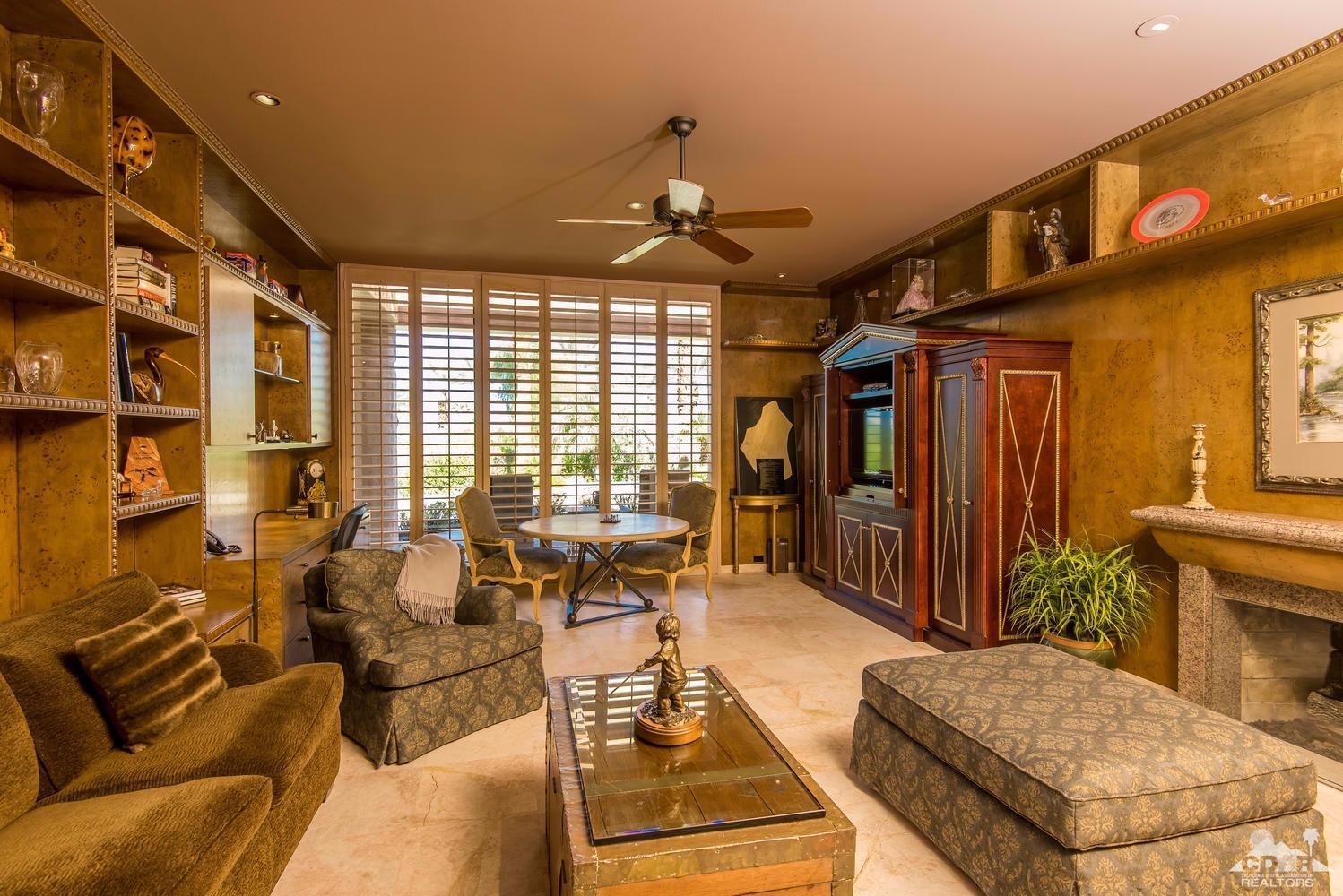 70416 Placerville Road Rancho Mirage, CA 92270 - Photo 21 of 32 a living room with furniture and a chandelier