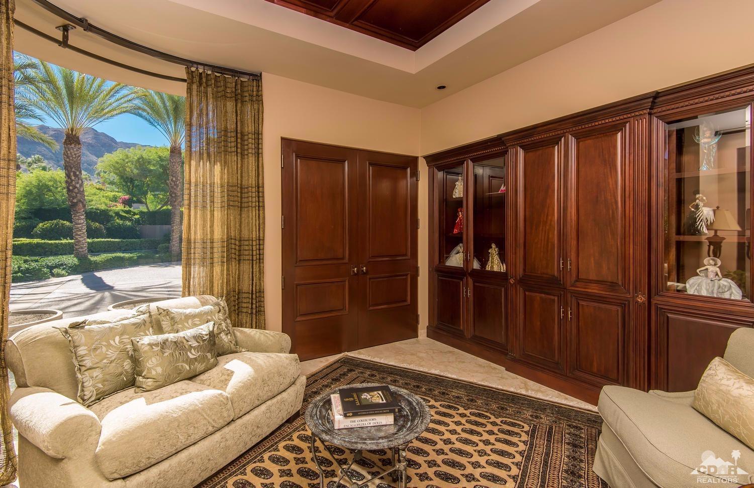 70416 Placerville Road Rancho Mirage, CA 92270 - Photo 22 of 32 a bedroom with a bed and glass door