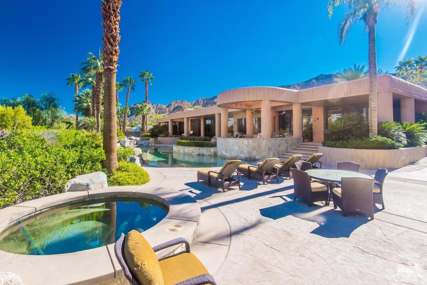 70416 Placerville Road Rancho Mirage, CA 92270 - Photo 25 of 32 a view of a patio with couches chairs and potted plants