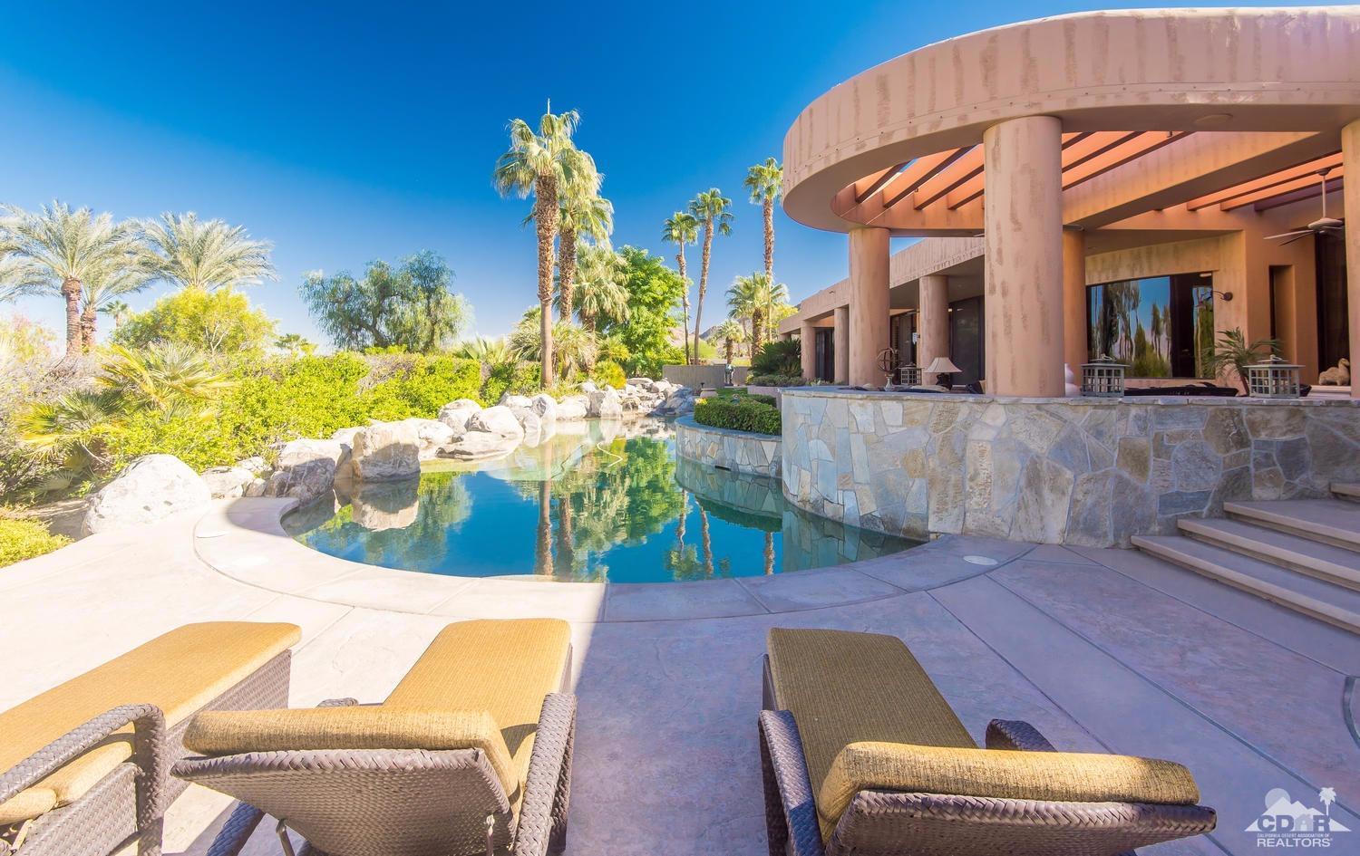 70416 Placerville Road Rancho Mirage, CA 92270 - Photo 26 of 32 a view of a patio with couches table and chairs and potted plants