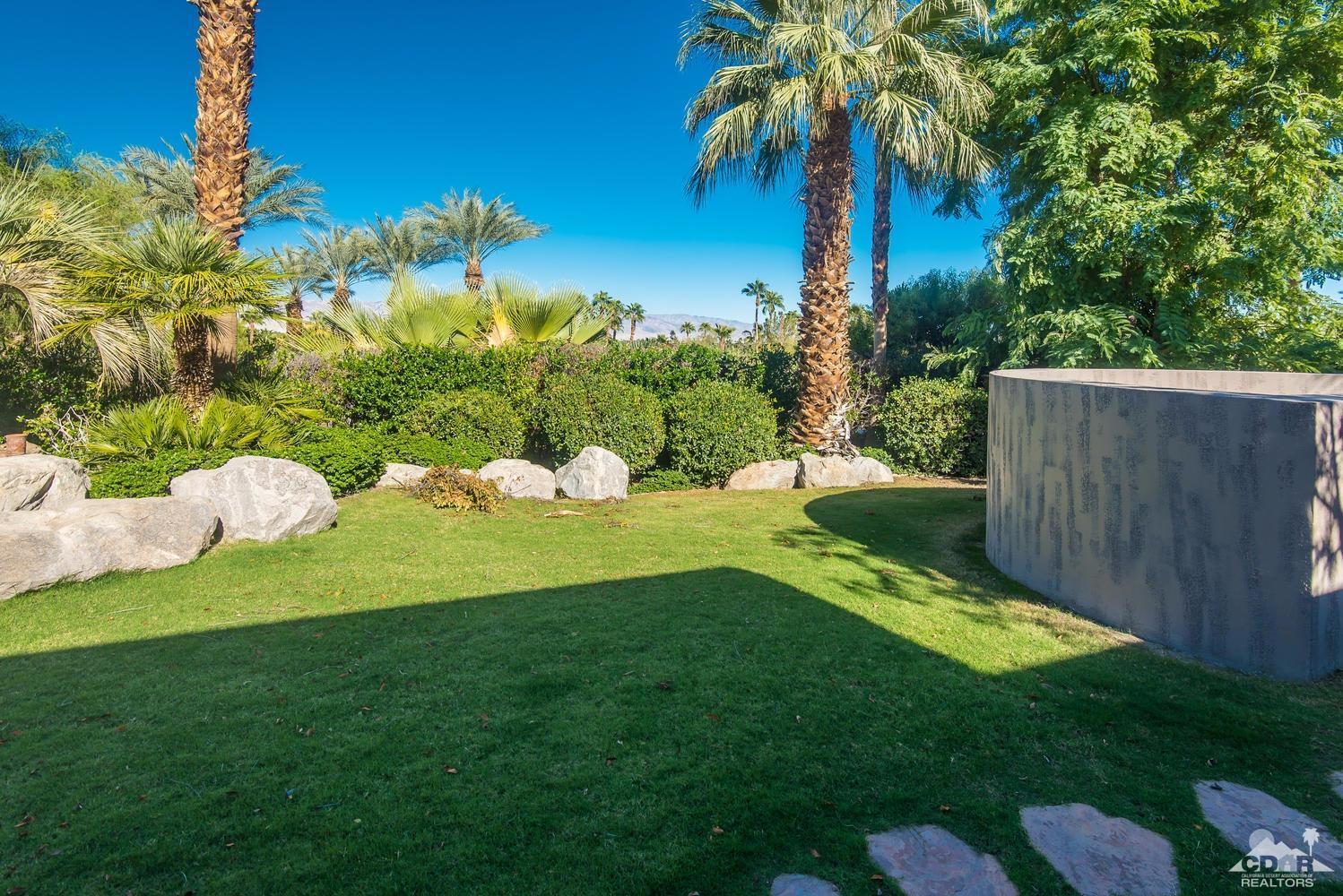 70416 Placerville Road Rancho Mirage, CA 92270 - Photo 32 of 32 a view of a garden with a house