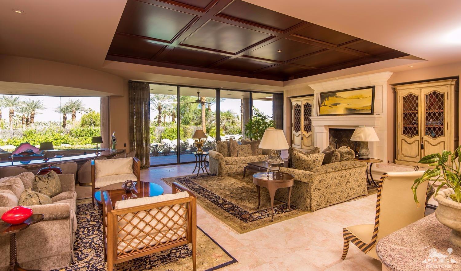 70416 Placerville Road Rancho Mirage, CA 92270 - Photo 7 of 32 a living room with fireplace furniture and a large window