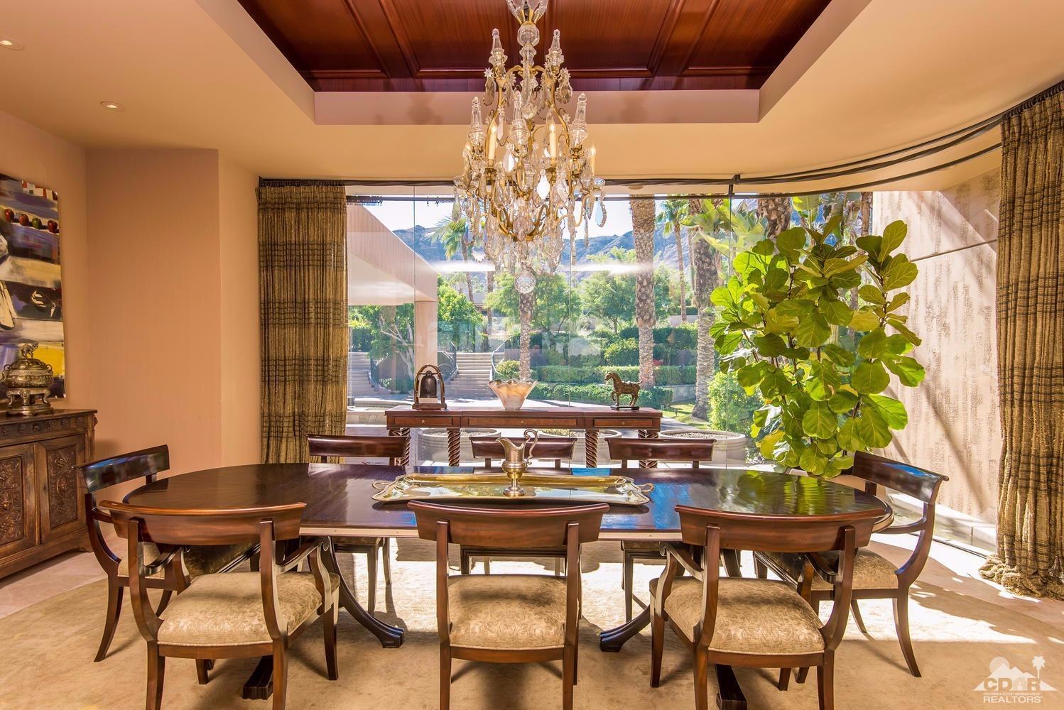 70416 Placerville Road Rancho Mirage, CA 92270 - Photo 10 of 32 a view of a dining room with furniture wooden floor and chandelier
