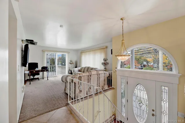 a view of a patio with iron fence