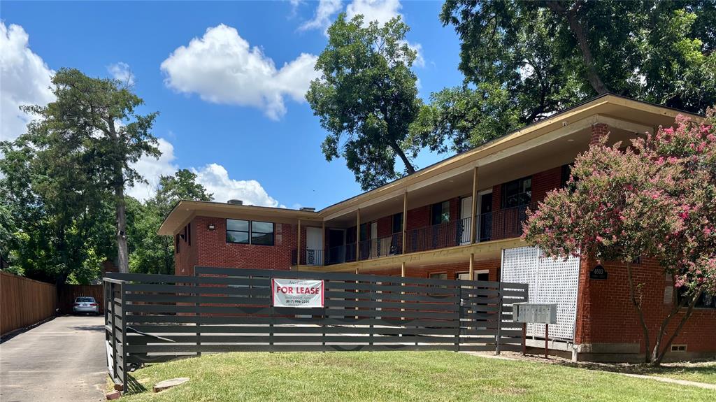 4603 Junius Street, Unit 8 Dallas, TX 75246 - Photo 14 of 15 a view of a house with a yard