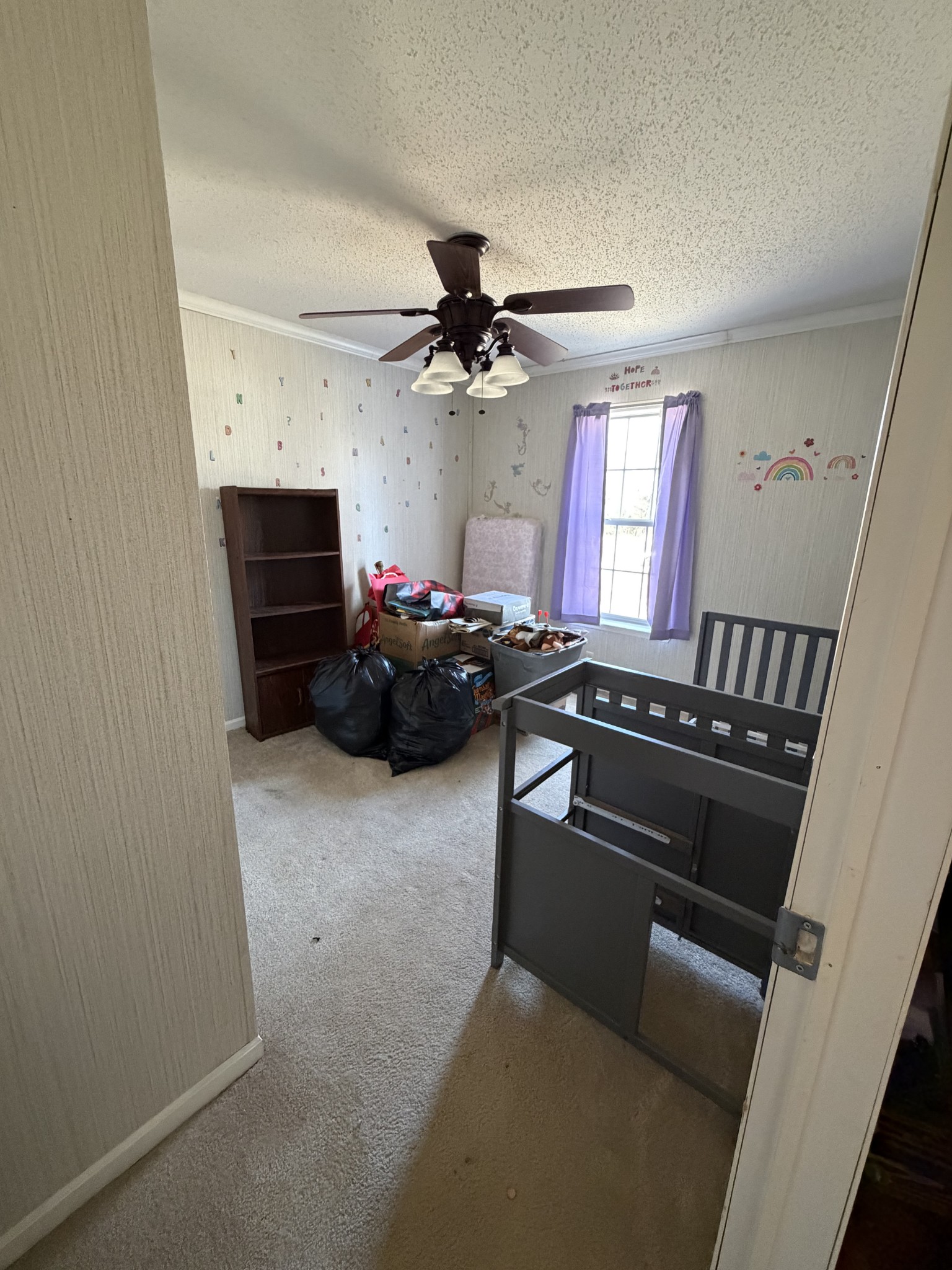7010 Lynchburg Road Winchester, TN 37398 - Photo 12 of 22 a living room with furniture a fireplace and a ceiling fan