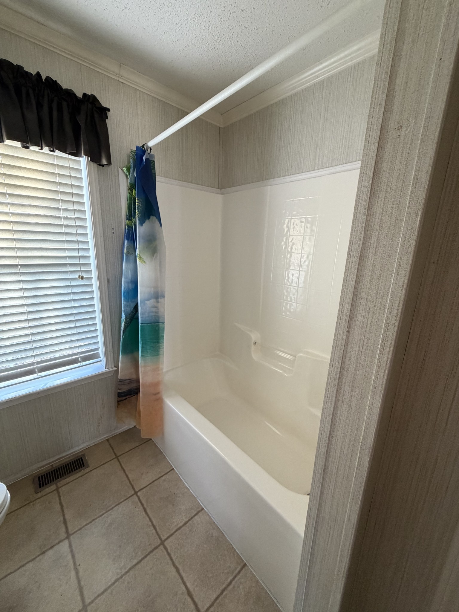7010 Lynchburg Road Winchester, TN 37398 - Photo 15 of 22 a bathroom with a bathtub and a shower