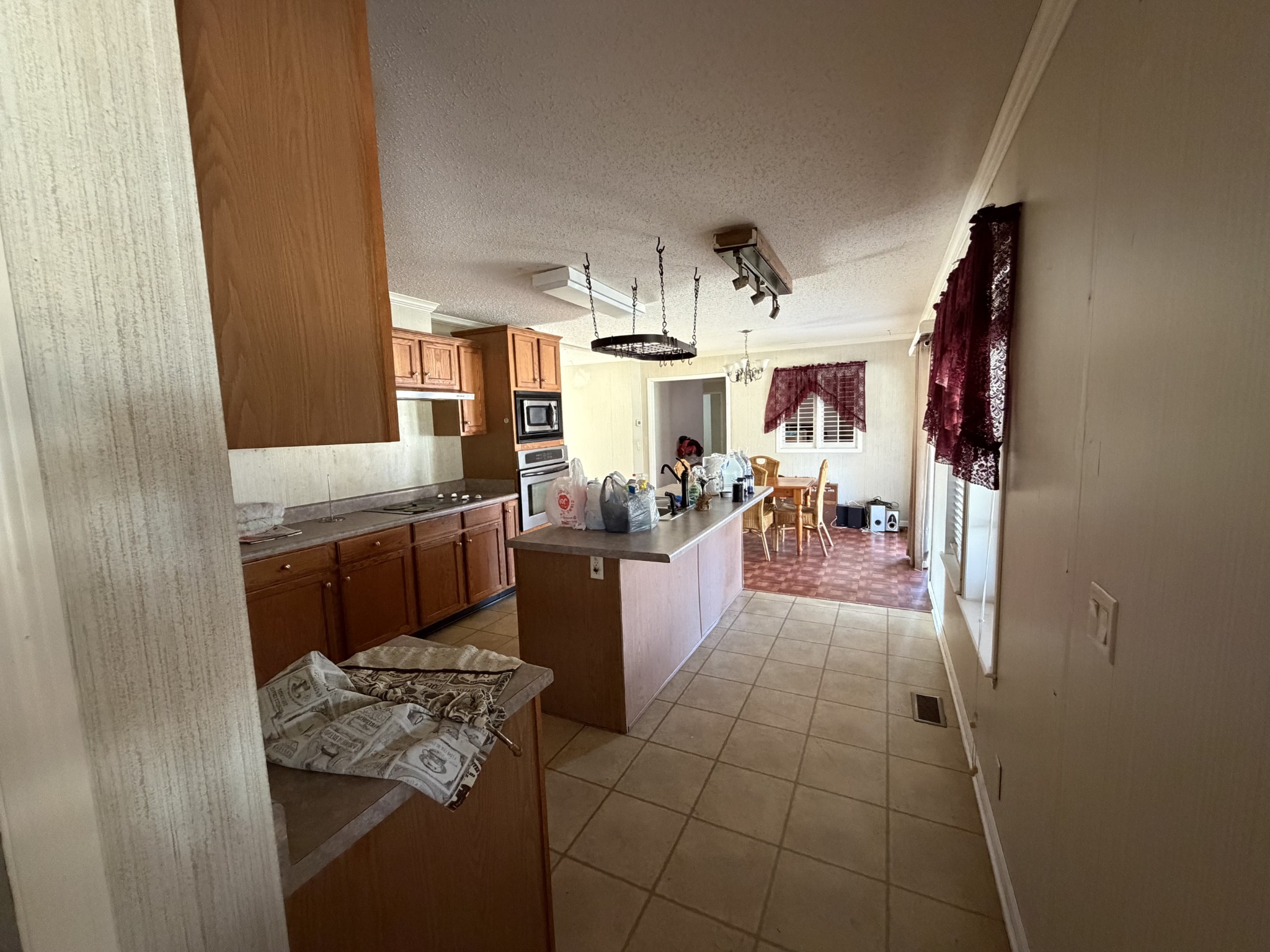 7010 Lynchburg Road Winchester, TN 37398 - Photo 4 of 22 a living room with couches and kitchen view with wooden floor