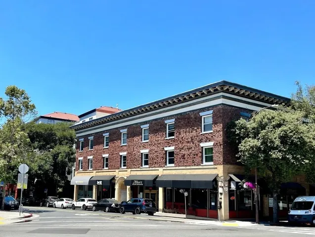 a view of a food mall next to a road