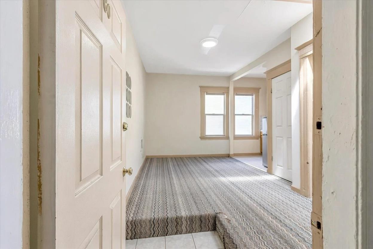 2171 Allston Way Berkeley, CA 94704 - Photo 6 of 10 a view of a room with wooden floor and window