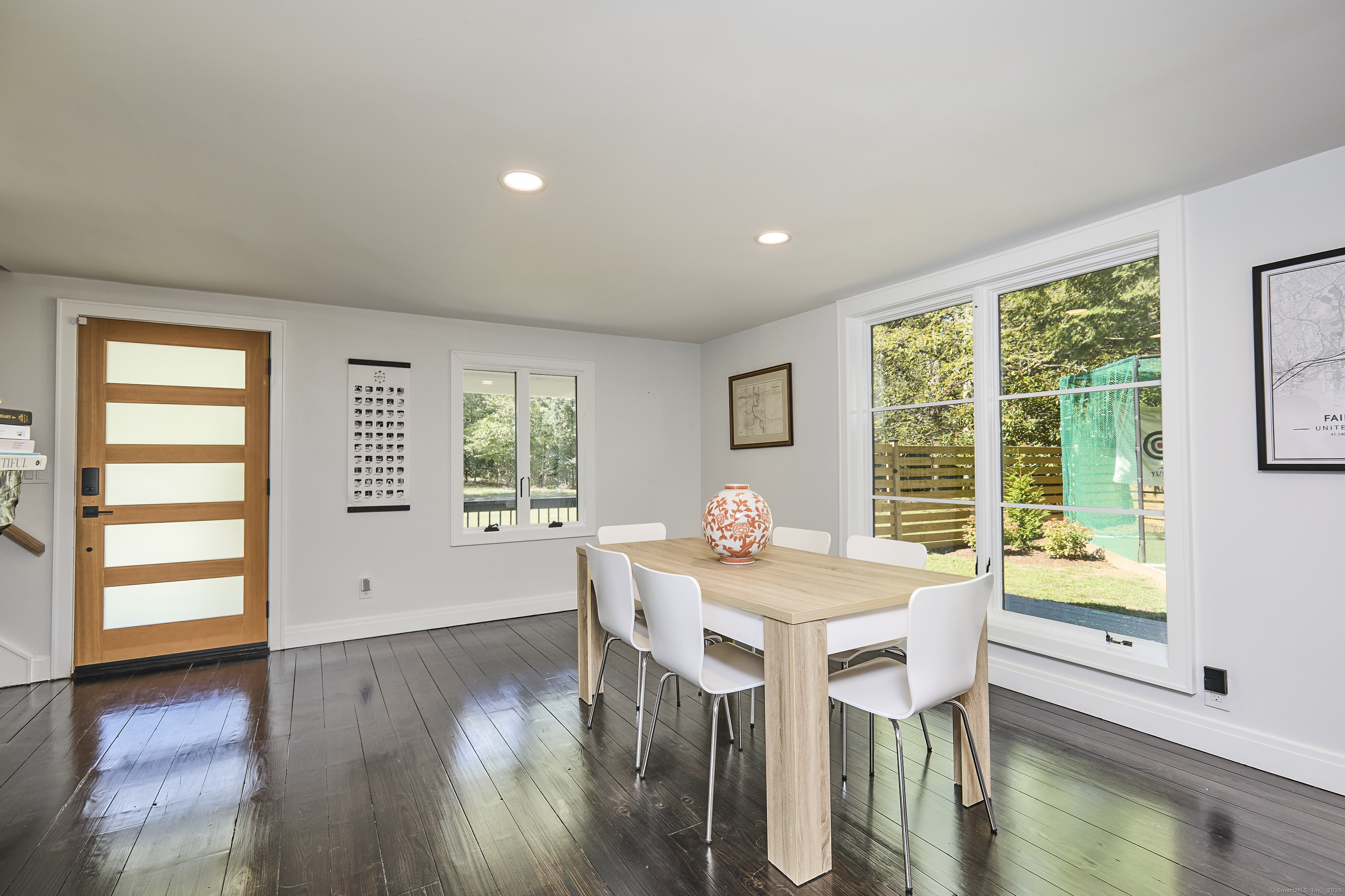 1207 Stillson Road Fairfield, CT 06824 - Photo 15 of 39 a dining room with furniture window wooden floor