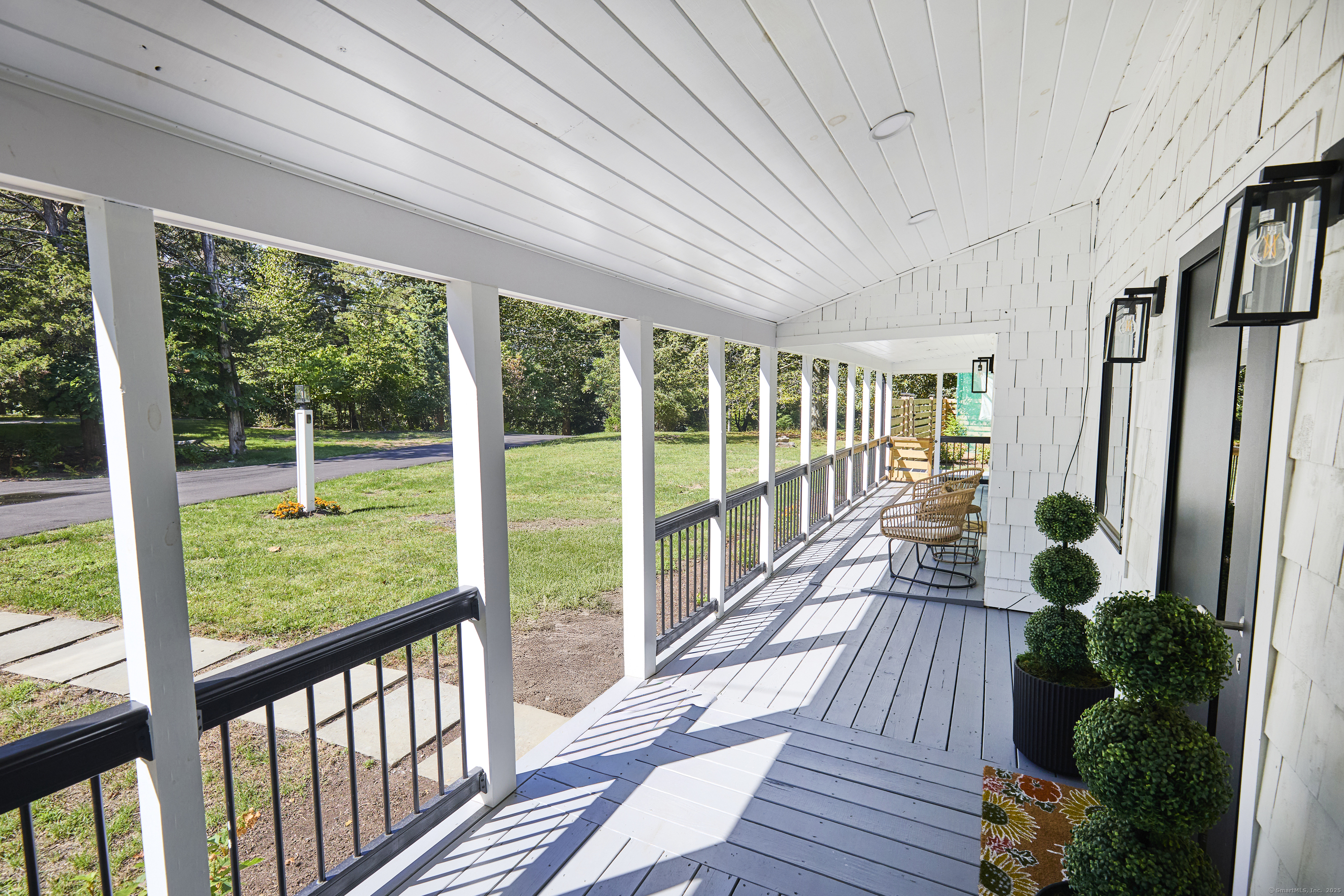 1207 Stillson Road Fairfield, CT 06824 - Photo 2 of 39 a view of a house with porch and wooden floor