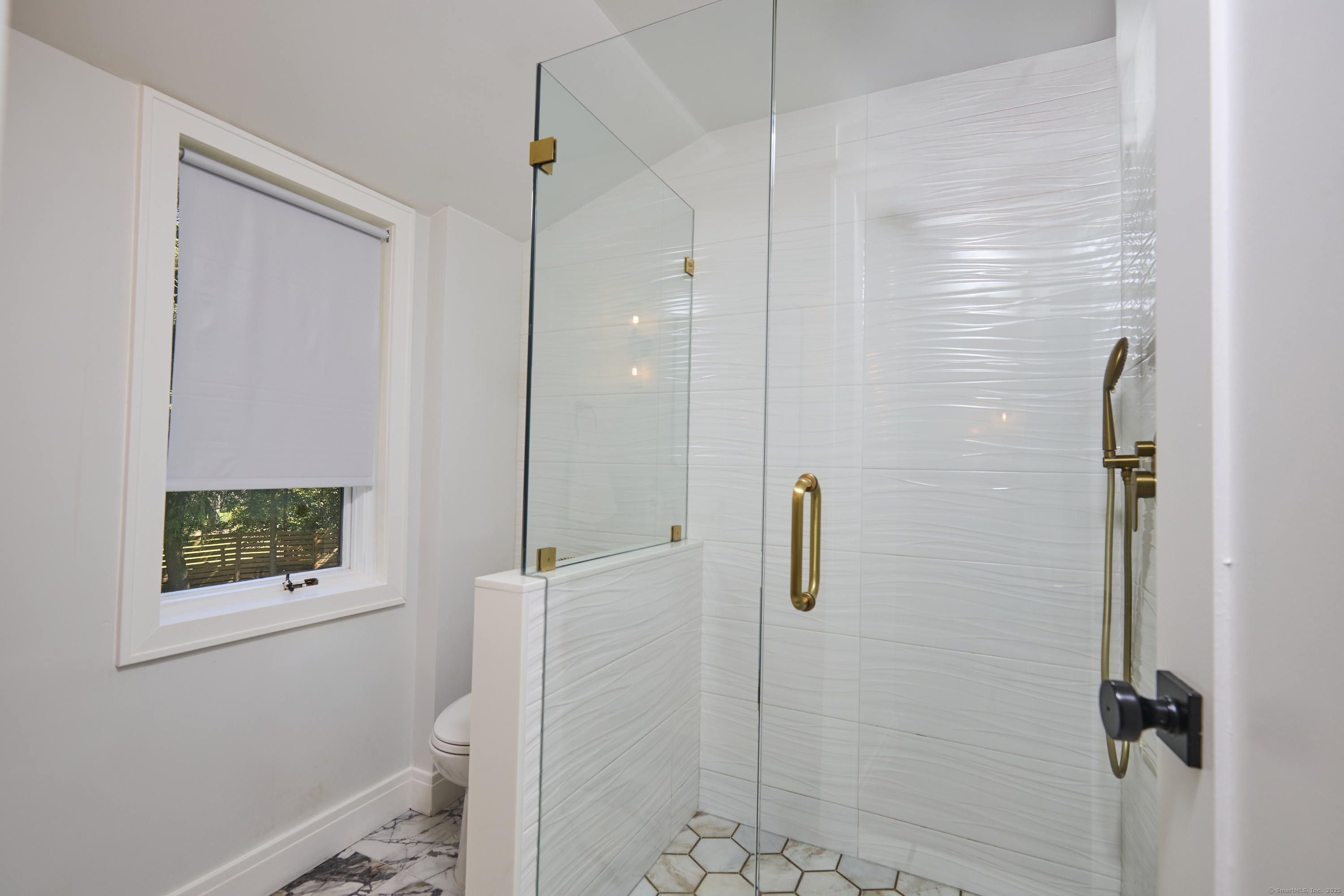 1207 Stillson Road Fairfield, CT 06824 - Photo 24 of 39 a bathroom with a shower