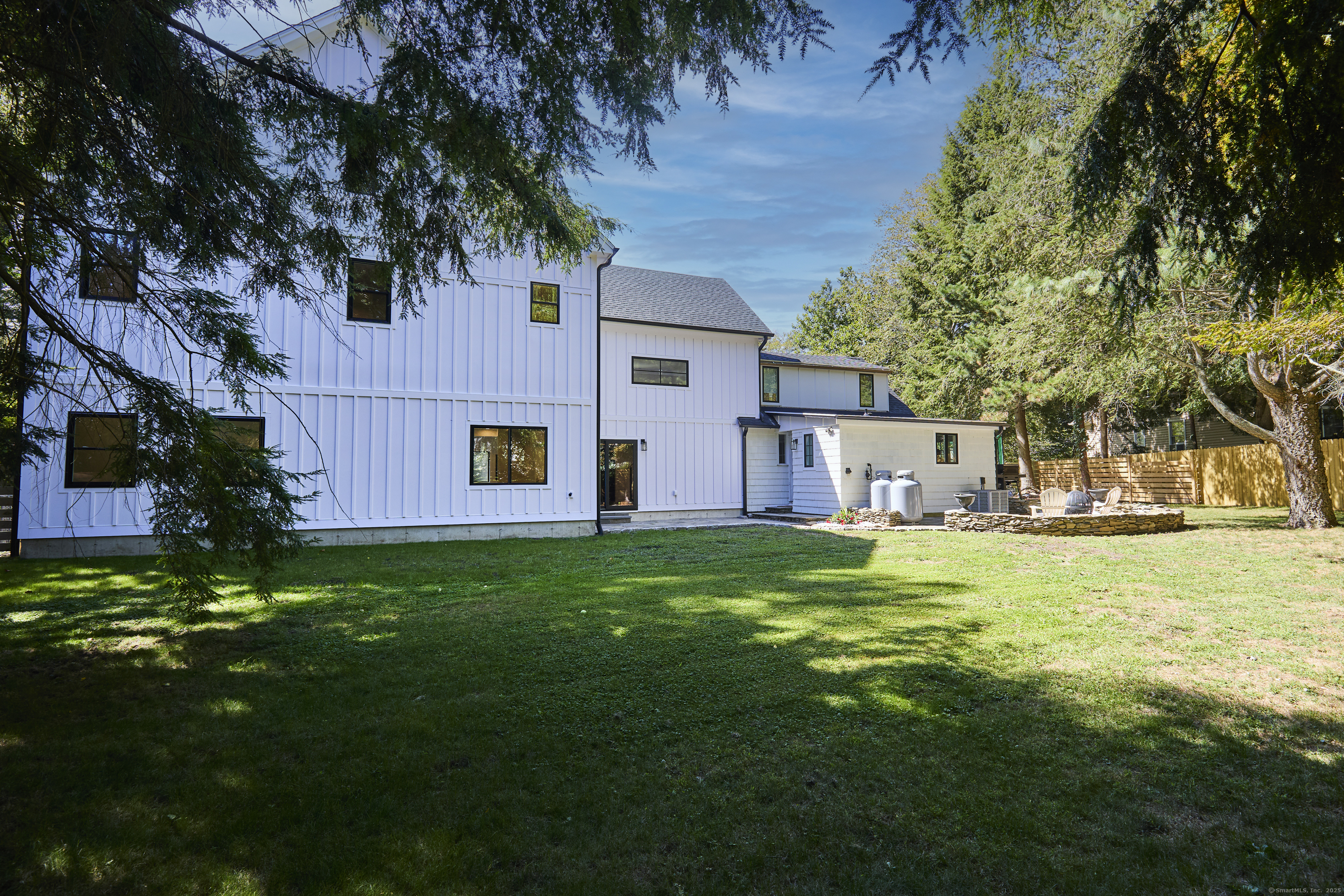 1207 Stillson Road Fairfield, CT 06824 - Photo 38 of 39 a view of a house with a back yard