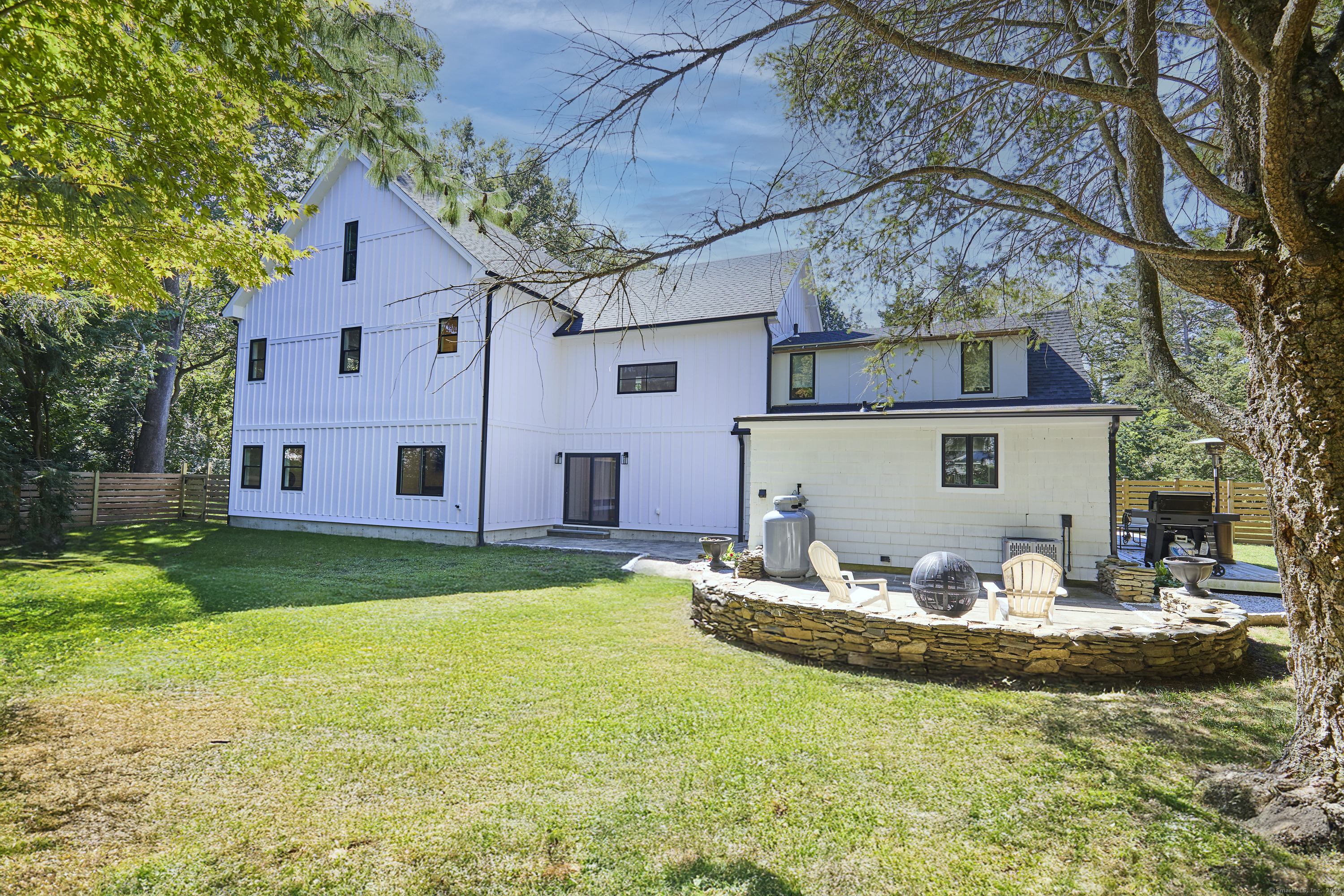 1207 Stillson Road Fairfield, CT 06824 - Photo 39 of 39 a front view of house with yard having outdoor seating