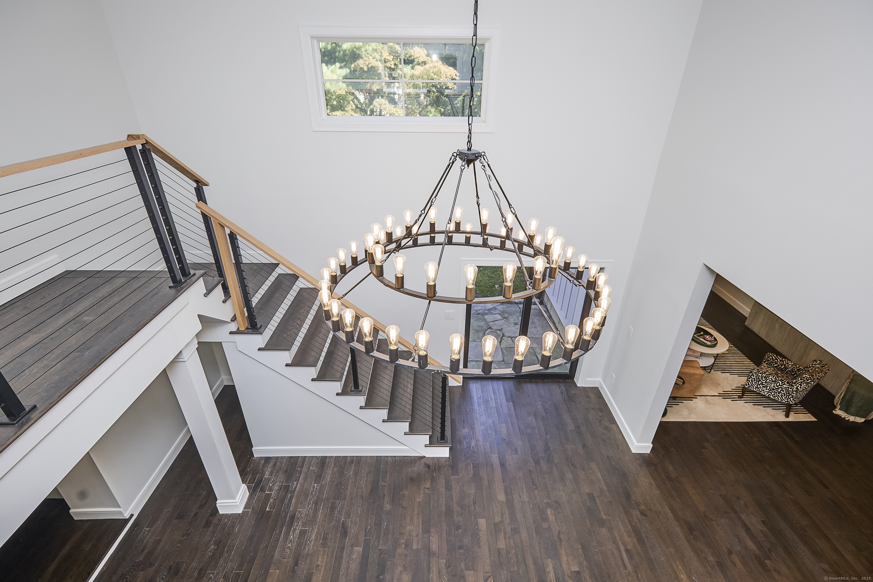 1207 Stillson Road Fairfield, CT 06824 - Photo 8 of 39 a view of entryway with wooden floor