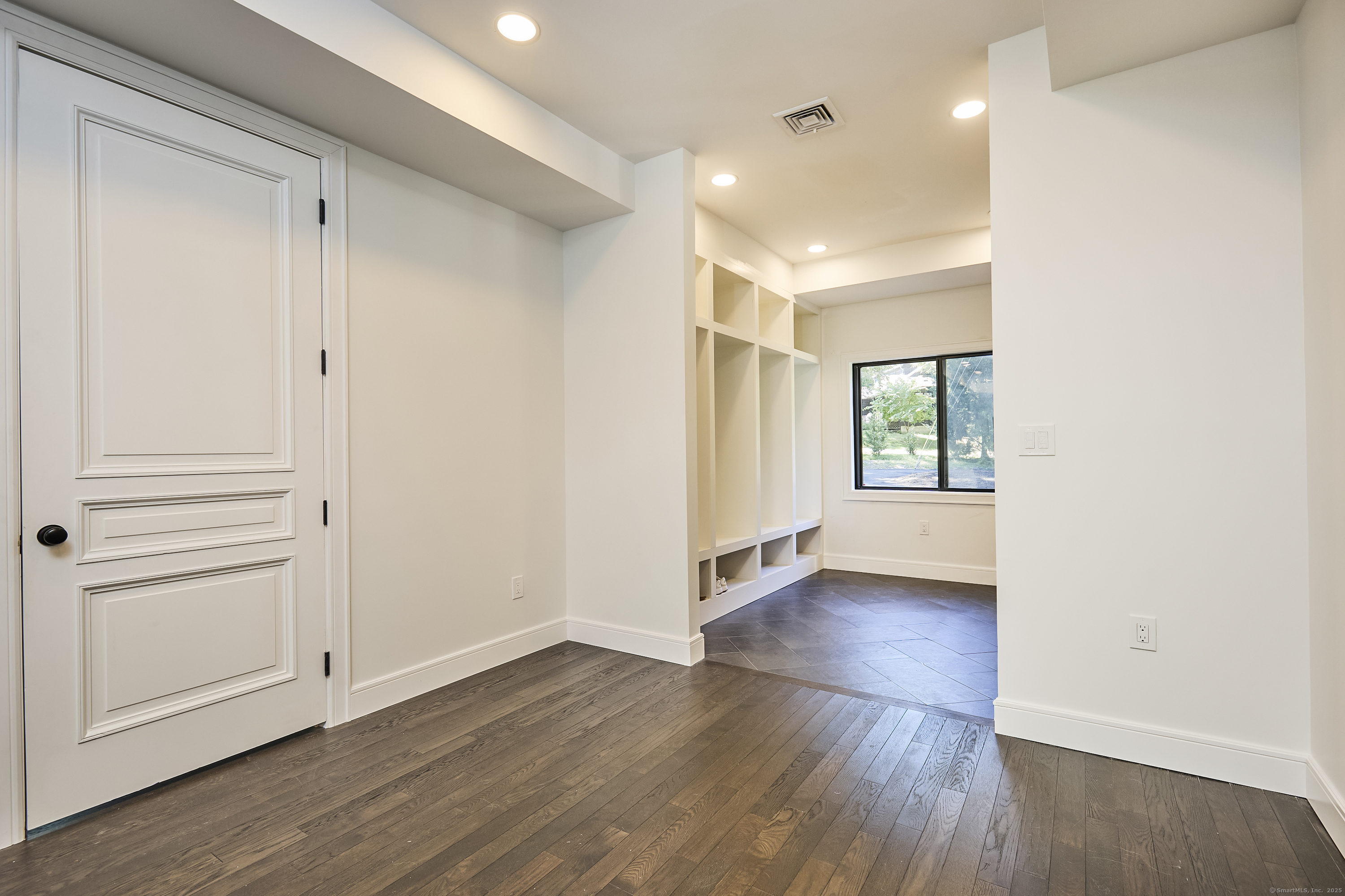 1207 Stillson Road Fairfield, CT 06824 - Photo 9 of 39 wooden floor in an empty room with a window