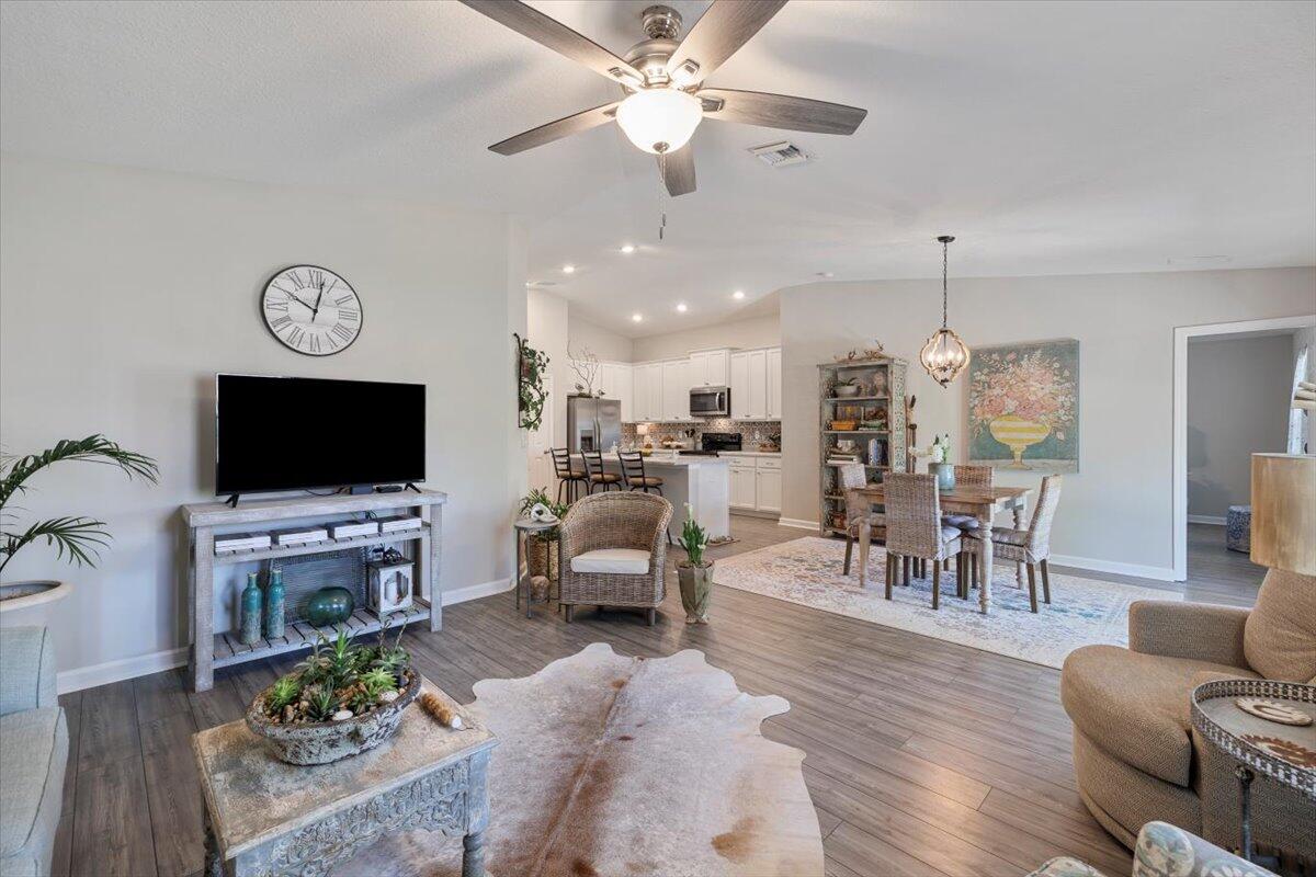 709 Riverwalk Circle Freeport, FL 32439 - Photo 15 of 28 a living room with furniture and a flat screen tv