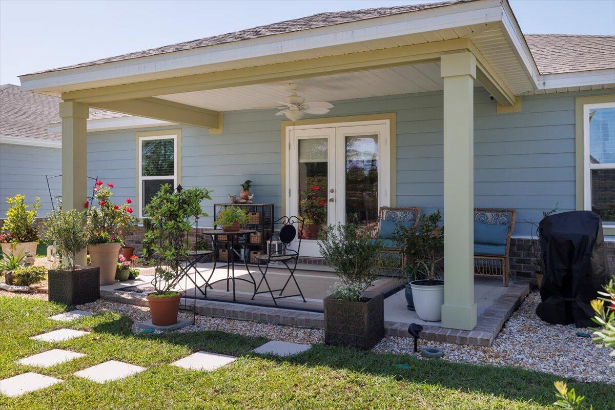 709 Riverwalk Circle Freeport, FL 32439 - Photo 25 of 28 a view of a house with backyard and sitting area