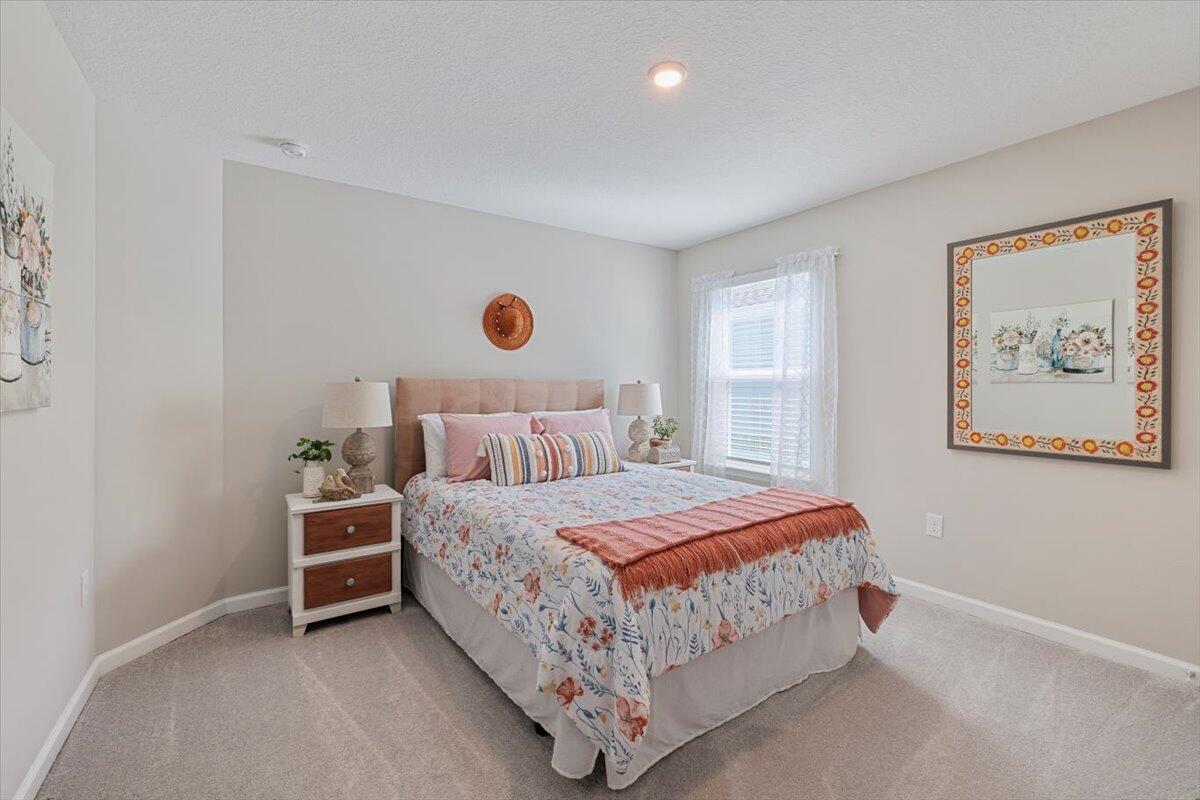 709 Riverwalk Circle Freeport, FL 32439 - Photo 4 of 28 a bedroom with a bed and window
