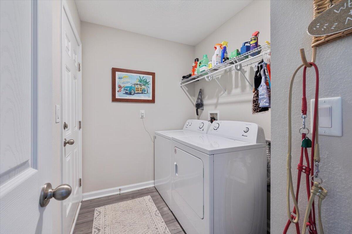 709 Riverwalk Circle Freeport, FL 32439 - Photo 7 of 28 a utility room with dryer and washer
