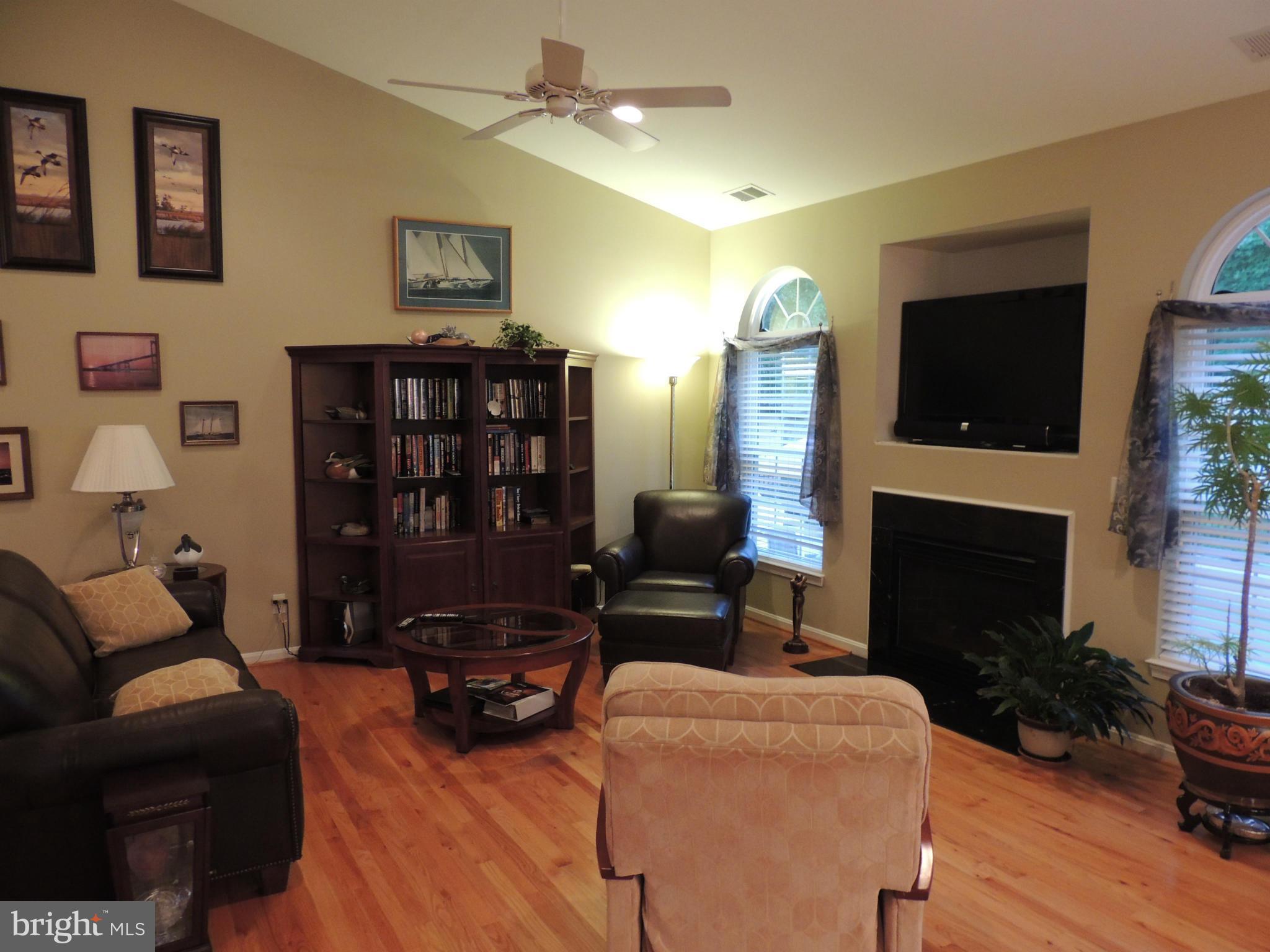 3602 Branhum Road Edgewater, MD 21037 - Photo 11 of 19 Family Room with hardwood floors and fireplace